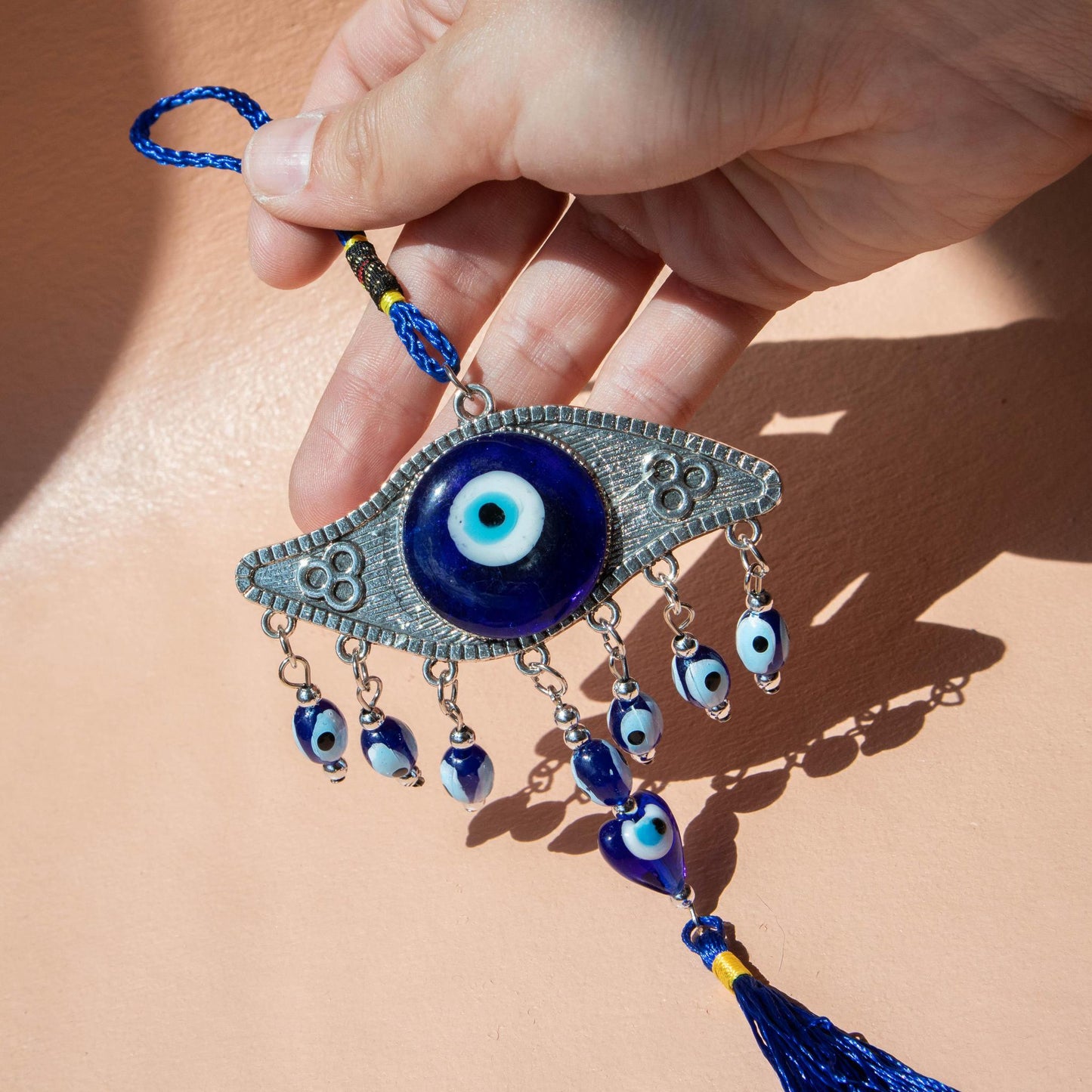 evil eye, evil eye hanging ornament, hanging evil eye, evil eye protection, evil eye accessory, evil eye tassle