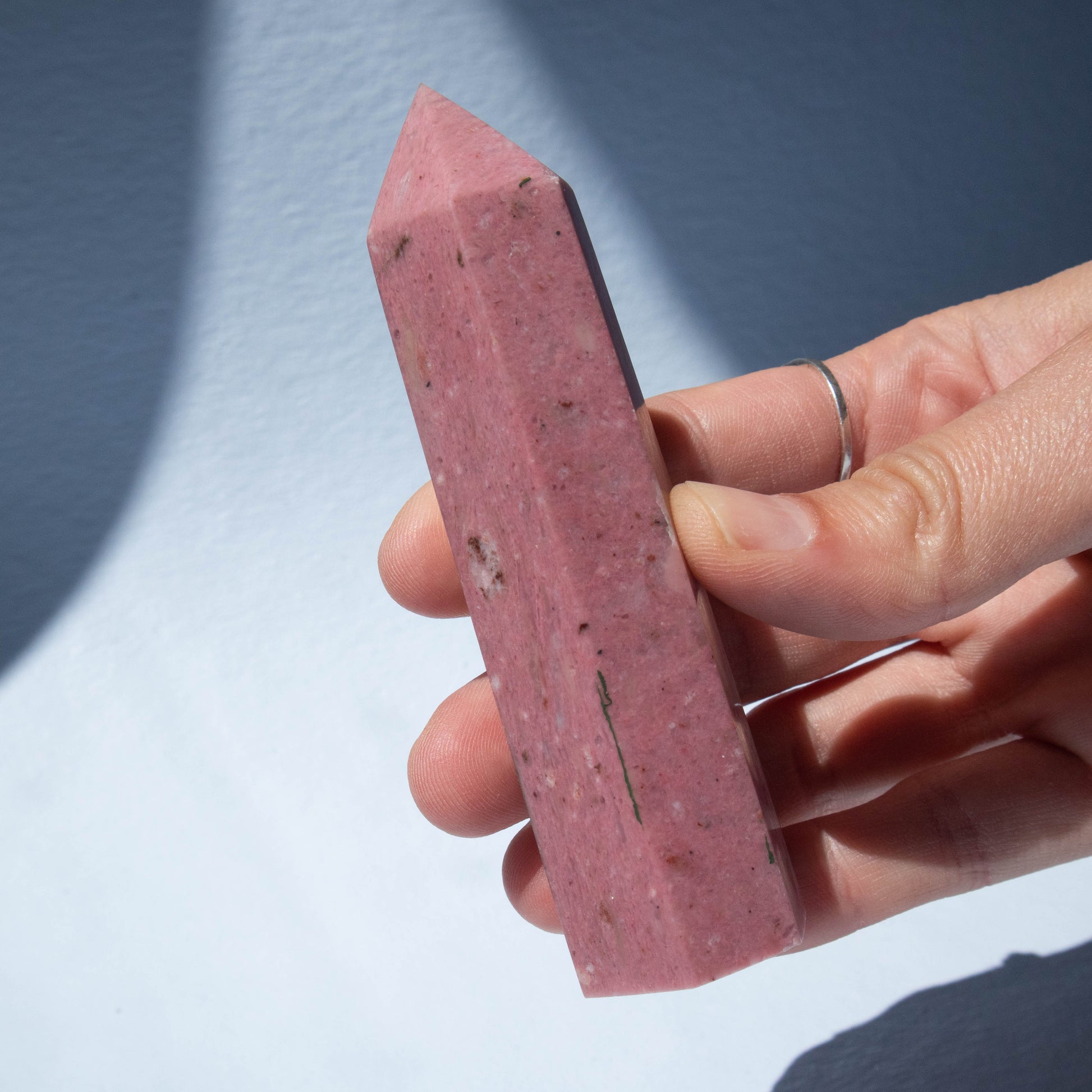 rhodonite, rhodonite obelisk, crystal obelisk, gemstone obelisk, rhodonite crystal, rhodonite stone, rhodonite gemstone, rhodonite properties, rhodonite healing properties, rhodonite metaphysical properties, rhodonite meaning