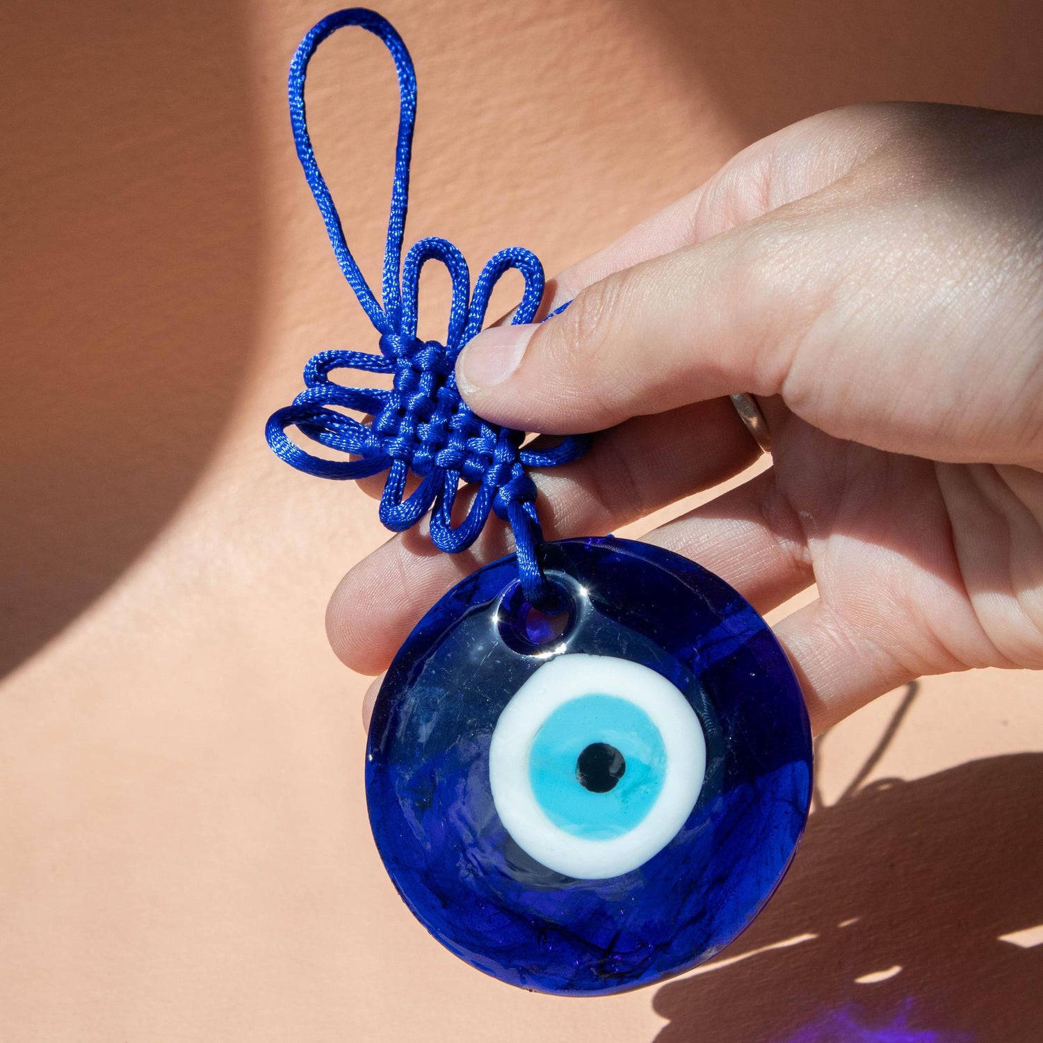 evil eye, evil eye protection, evil eye hanging ornament, evil eye accessory, glass evil eye, evil eye knot